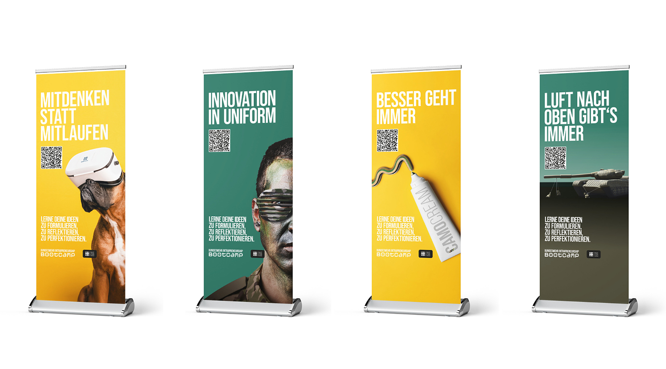 Vier vertikale Banner zeigen deutsche Slogans mit plakativen Bildern: ein Hund mit VR-Brille, ein Mann mit Tarnfarbe im Gesicht, eine Hundemarke mit BIODCARD und ein Panzer. Jedes ist mit einem QR-Code und dem BIOCOMP-Branding versehen.